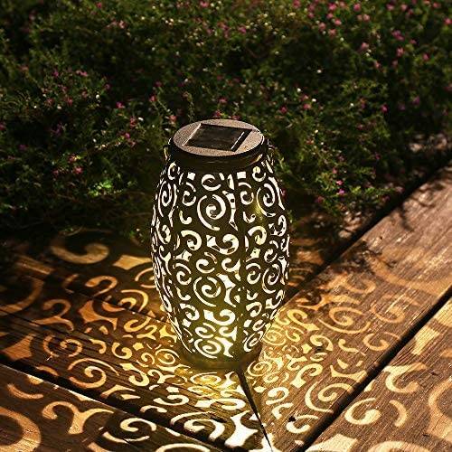 outdoor lantern with design that displays light patterns on ground