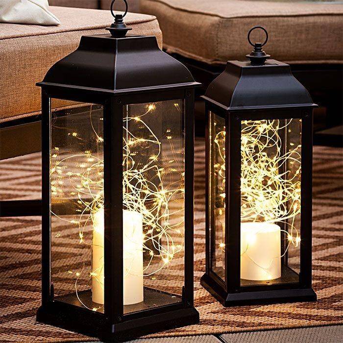 fairy lights inside black iron lantern casing