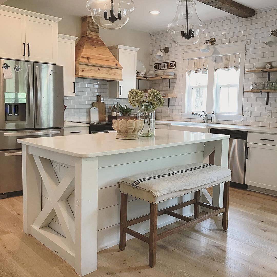 cottage-style kitchen island set up with white wood and light wood accents