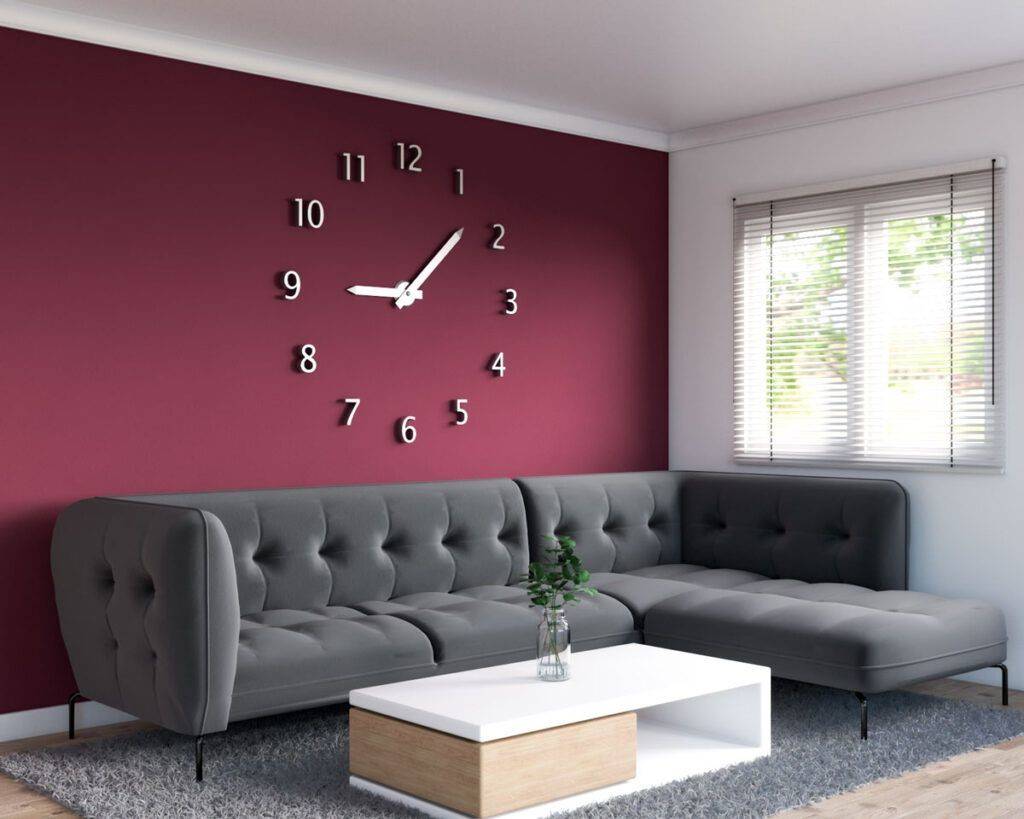 Maroon wall with clock