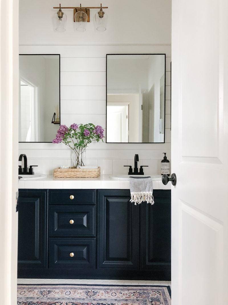 Double mirrors above a vanity sink