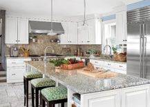 speckled granite kitchen island with colorful stools