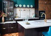green kitchen paint against dark wood cabinets and marble countertops