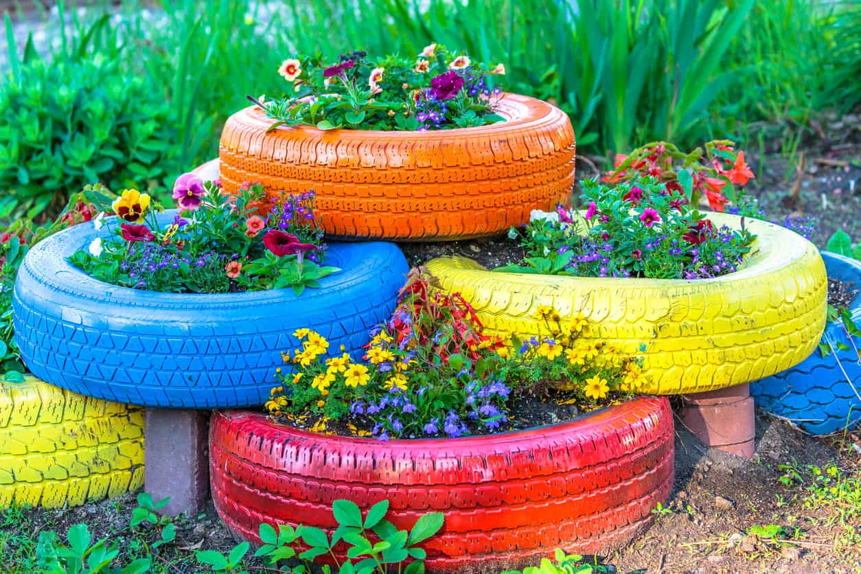 multi colored upcycled tire planters