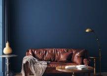 Rich leather sofa against blue wall