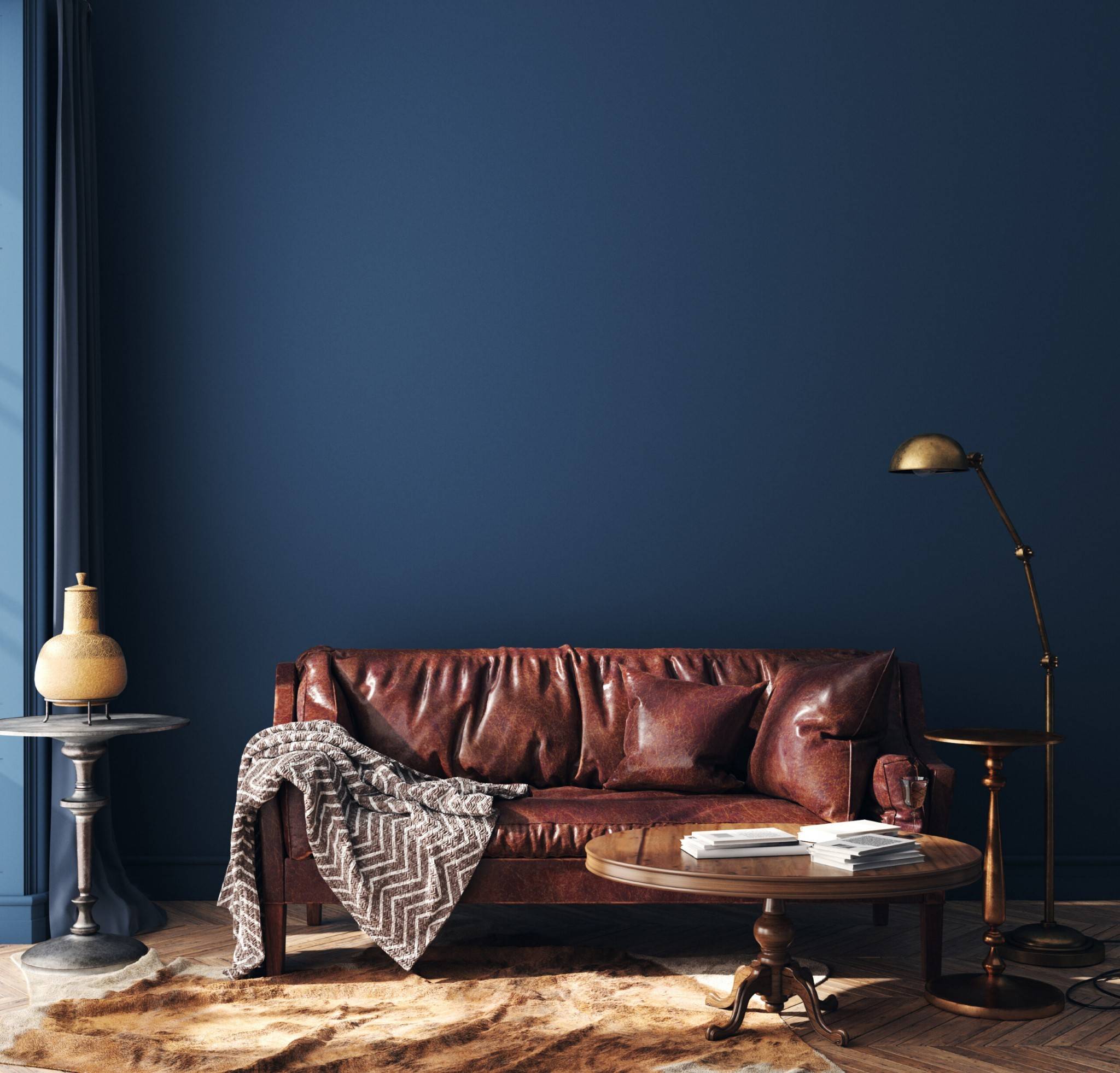 Rich leather sofa against blue wall