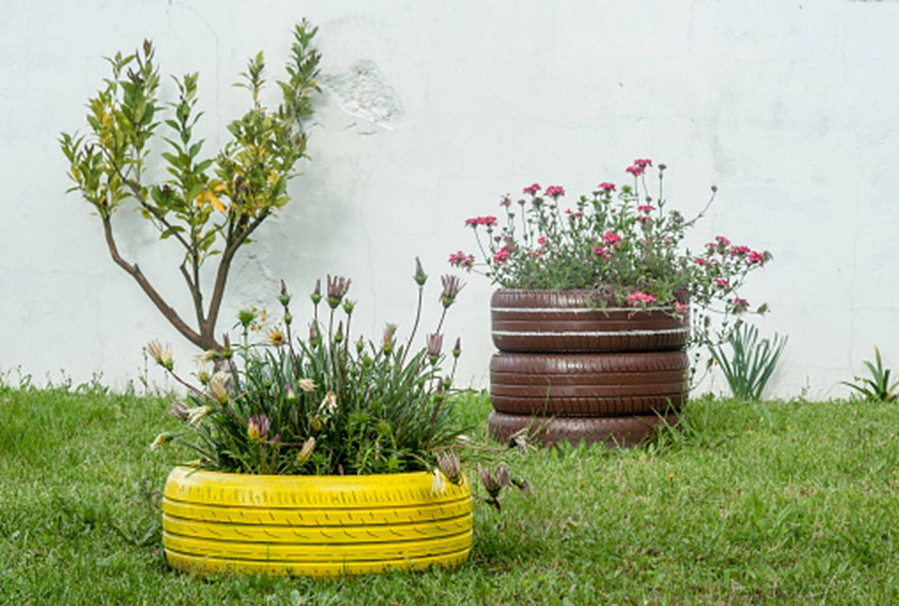 yellow and brown painted tire planters