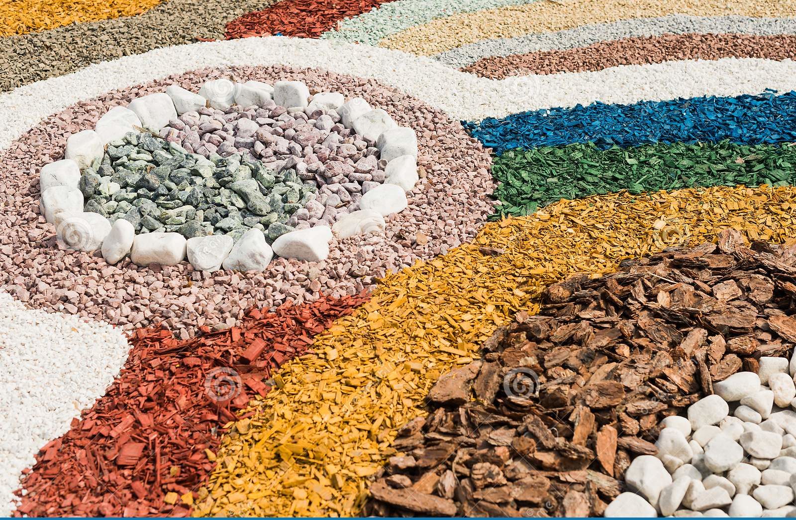 stones and colored woodchips combine to make design