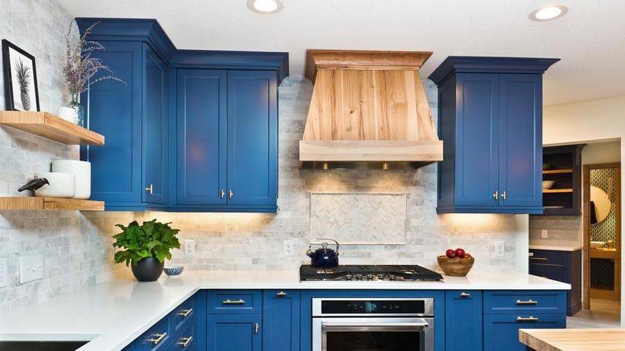 bright blue kitchen cabinets against white countertops