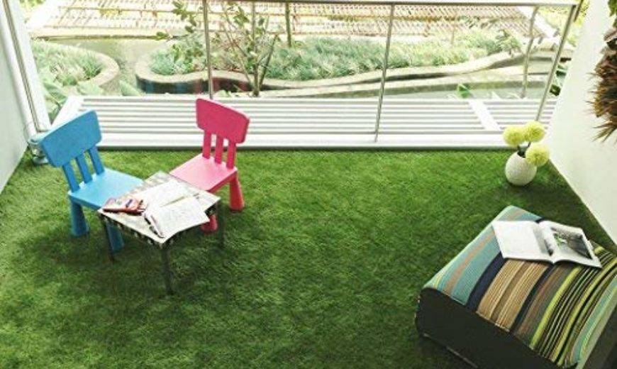 faux grass on balcony with colorful patio furniture