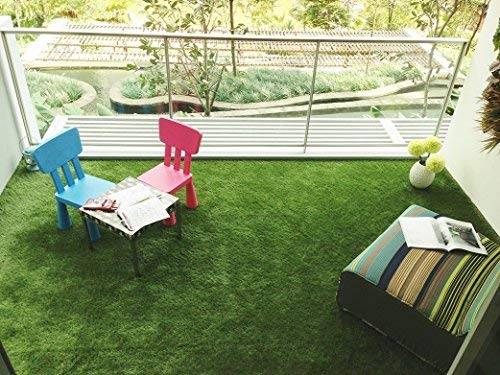 faux grass on balcony with colorful patio furniture