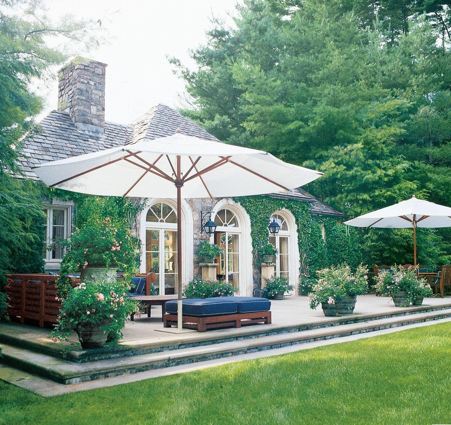 umbrella-covered patio in spacious backyard