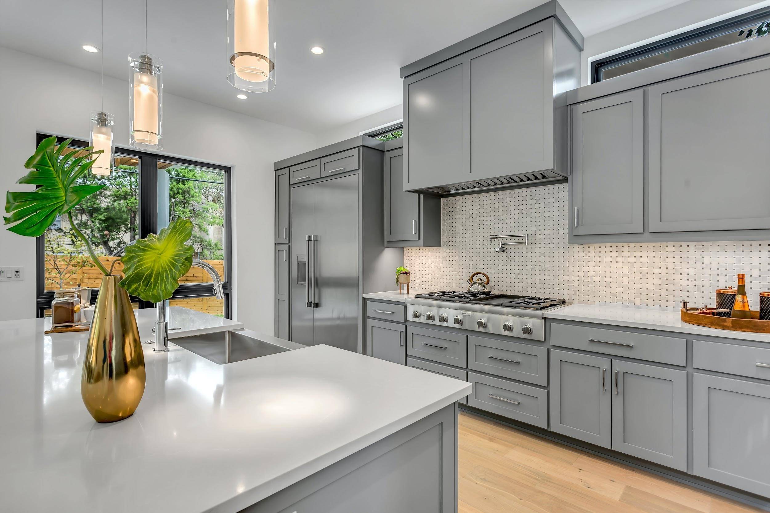 Dove grey granite countertops among shades of grey kitchen decor