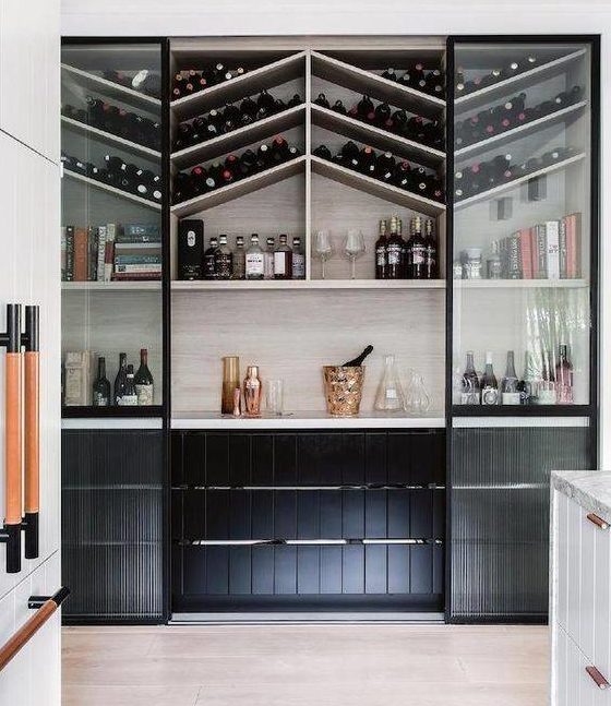 walk-in pantry with a unique arrangement for wine bottles and drinking glasses