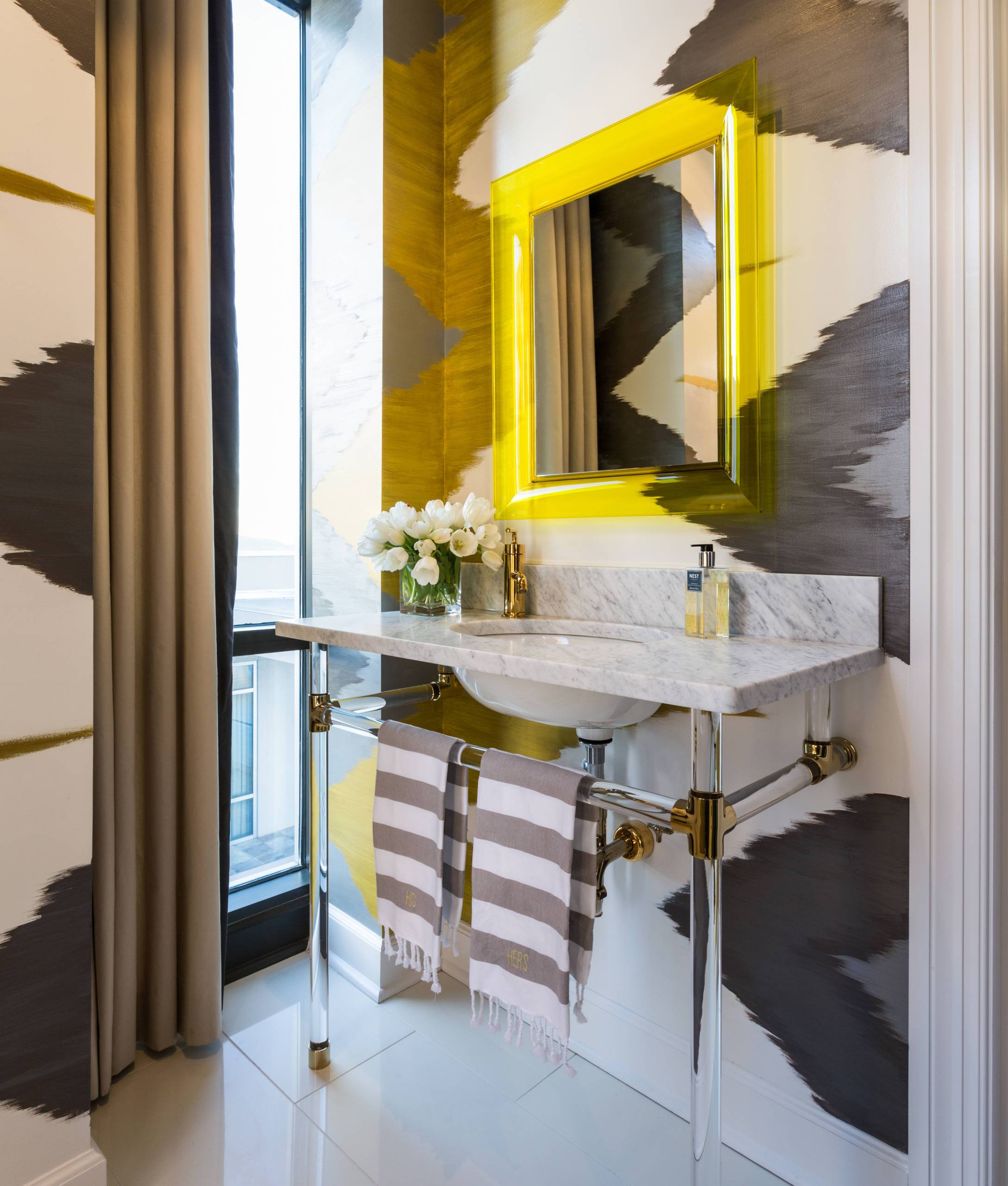 Bold wallpaper in black an white brings intrigue and pattern to this small contemporary bathroom