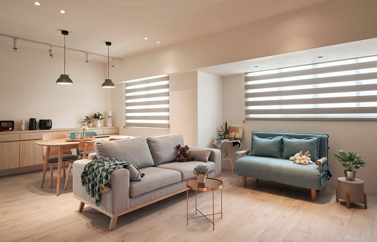 Contemporary refurbishment of small apartment in Taipei with a neutral backdrop and wooden flooring