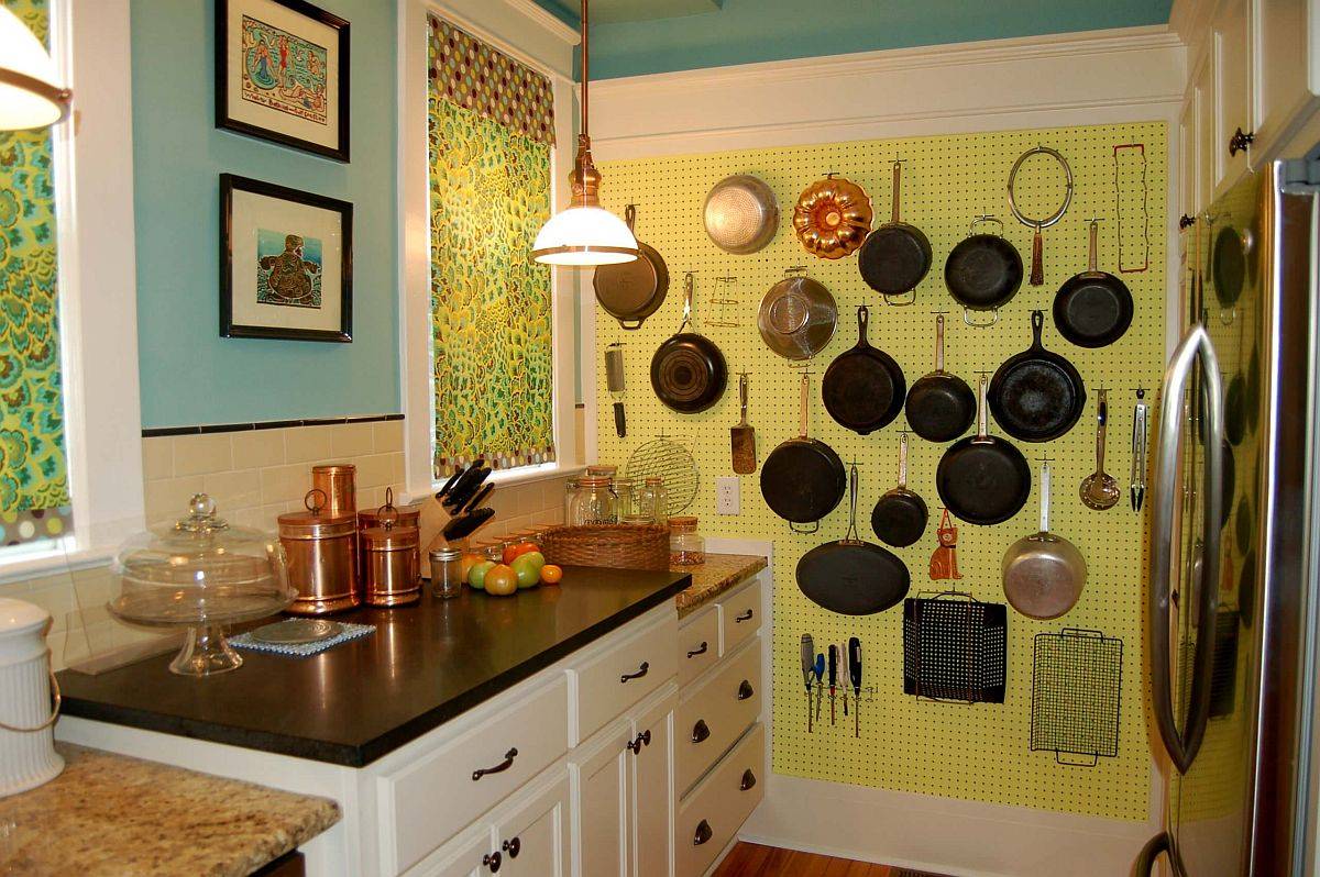 Dashing pegboard in yellow makes most of the vertical space on offer in the tiny kitchen