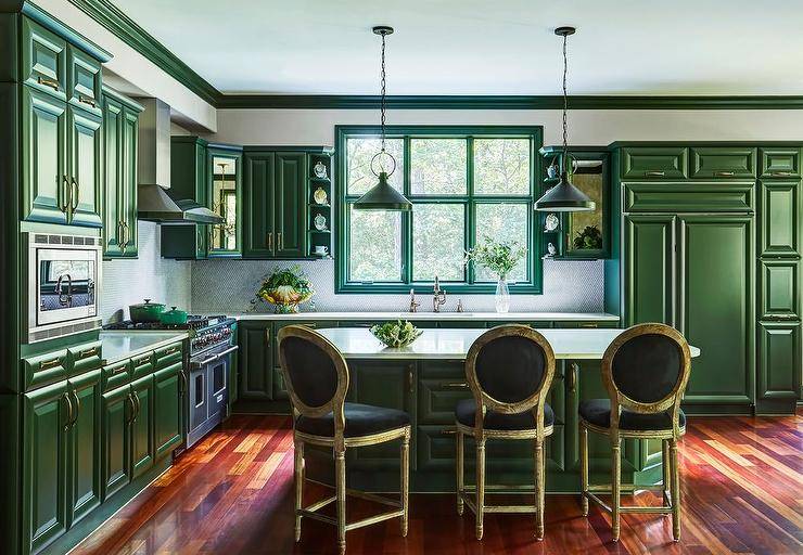 emerald green kitchen with white countertop island black velvet bar stools