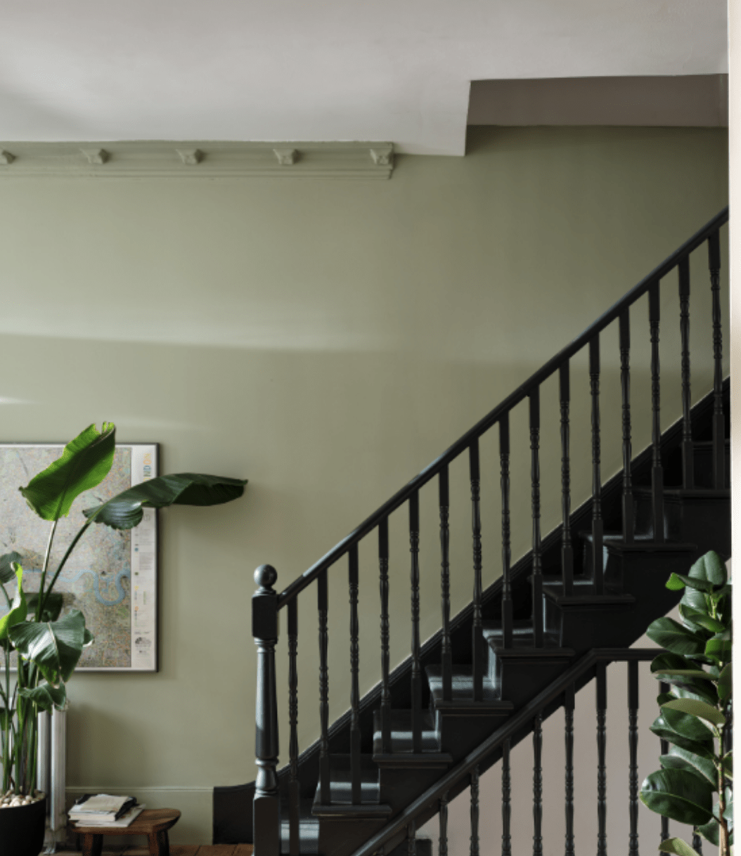 farrow and ball vert de terre green paint color on wall black staircase