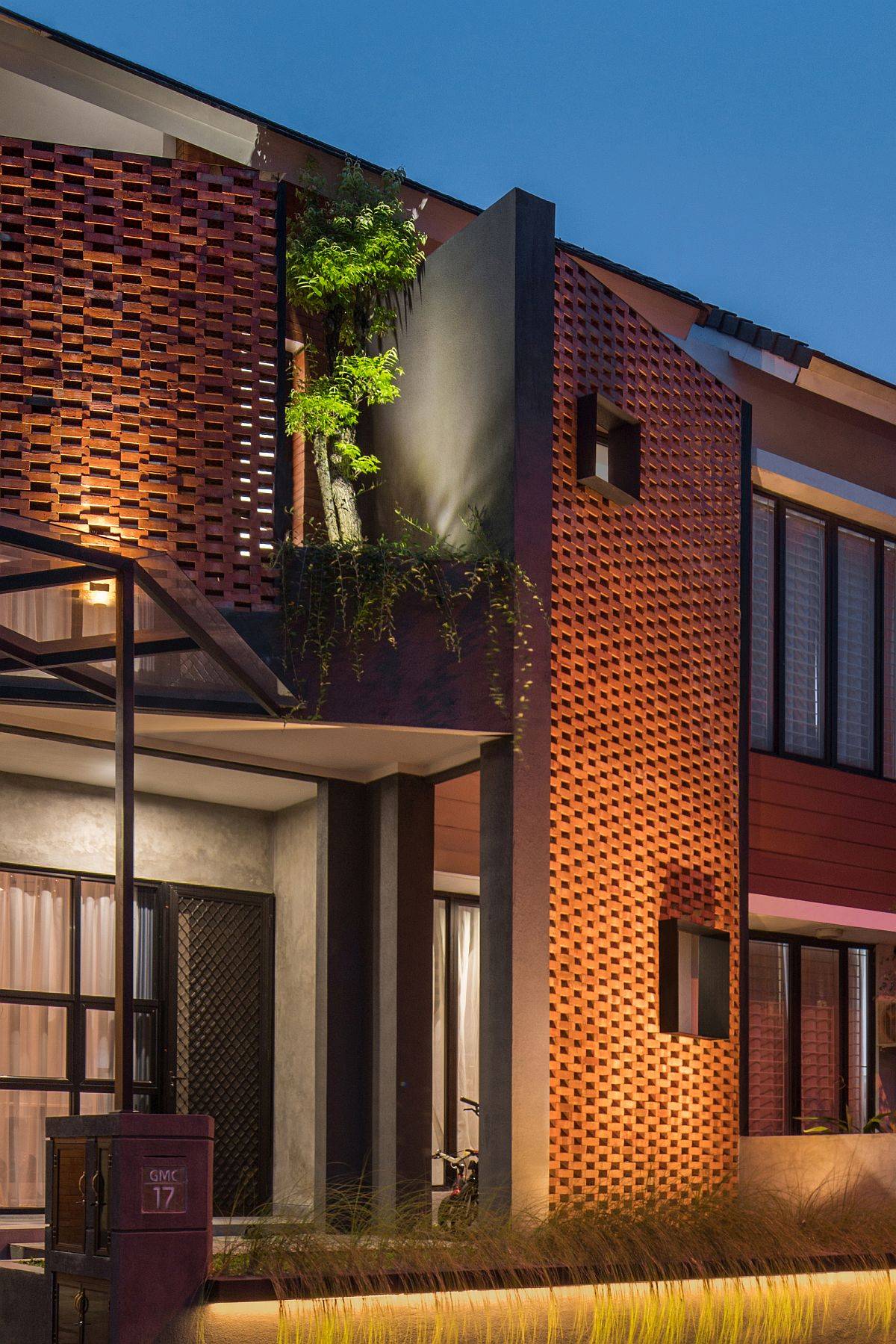 Gorgeously lit brick facade of the home after sunset