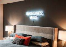 Illuminated-sign-on-the-wall-only-adds-to-the-aura-of-this-classy-bachelor-bedroom-59400-217x155
