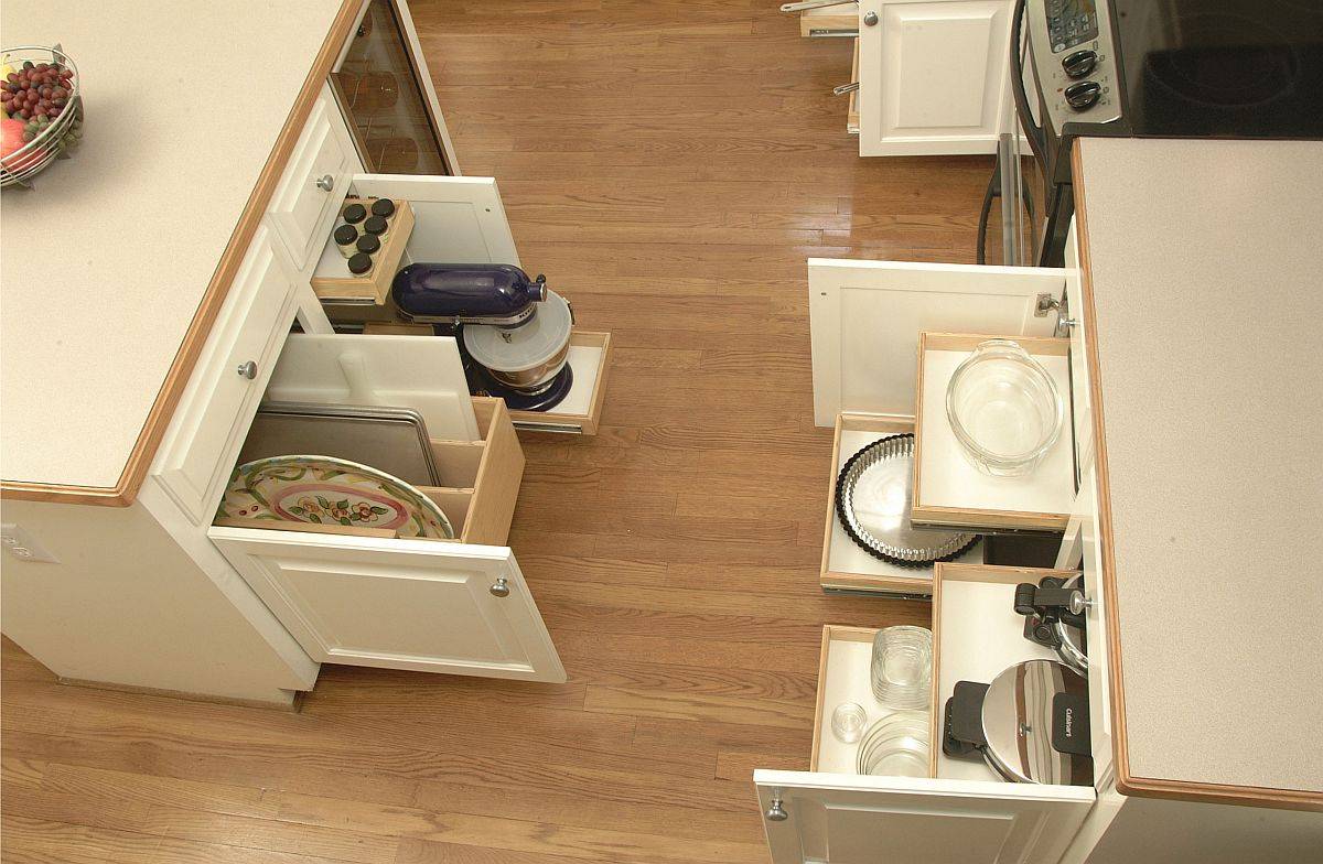 Innovative shelves glide out when needed to save space in this contemporary kitchen