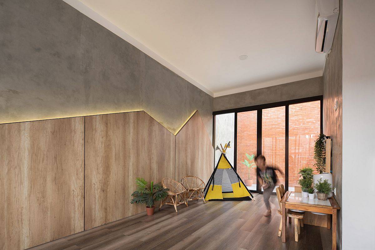 LED strip lighting, wooden accents and concrete walls create a fabulous kids' room