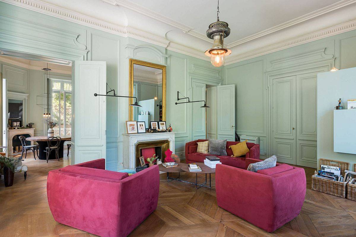 Light pastel greens coupled with hot pinks in the goregous contemporary living room of French home