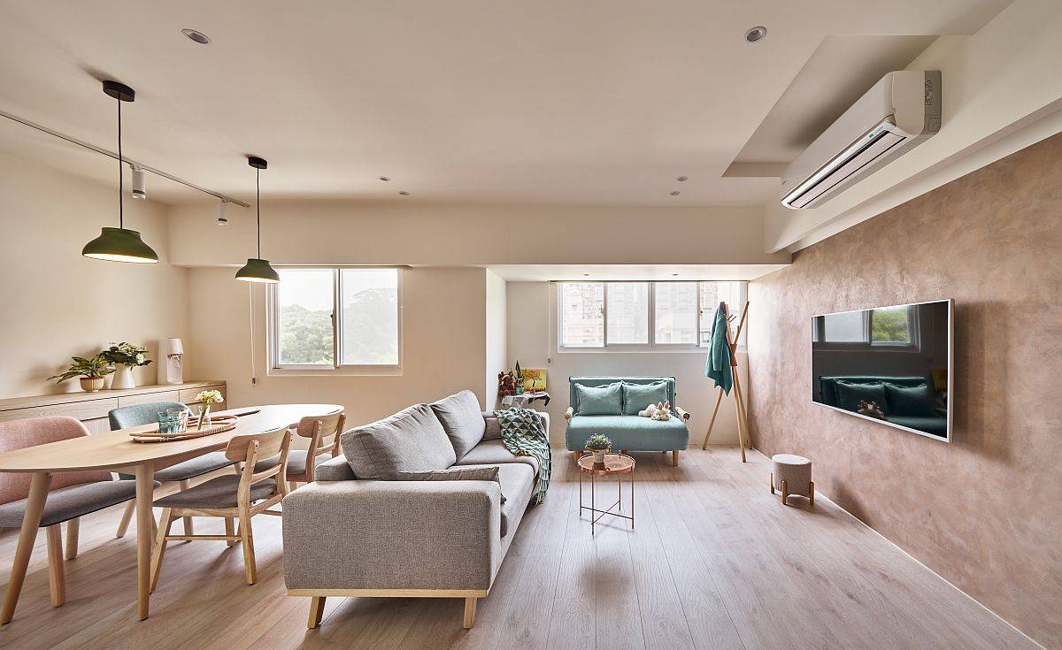 Modern living area and dining space of the small apartment in Taipei with a space-savvy design