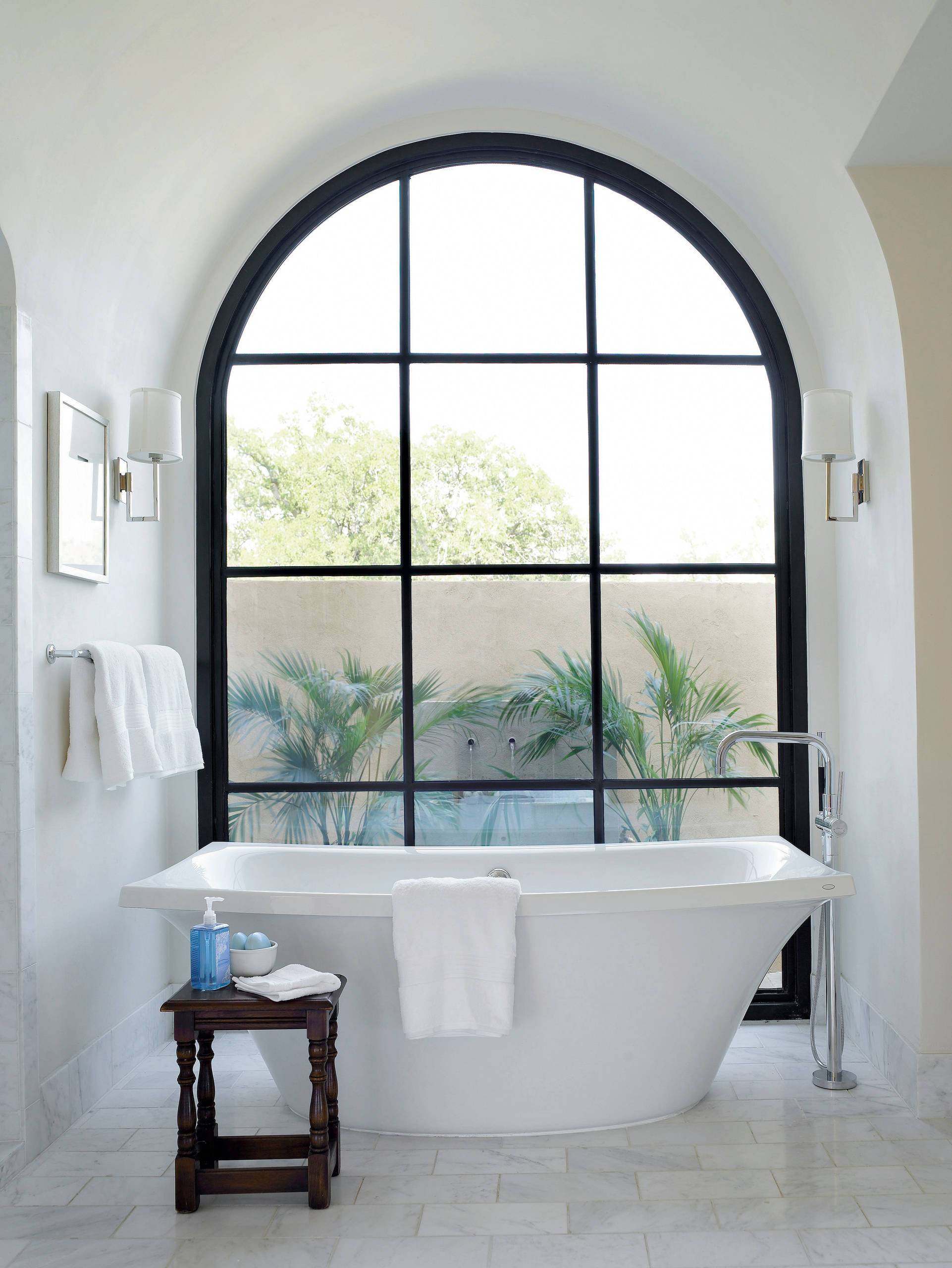 More modern take on the classic arched window for the contemporary bathroom