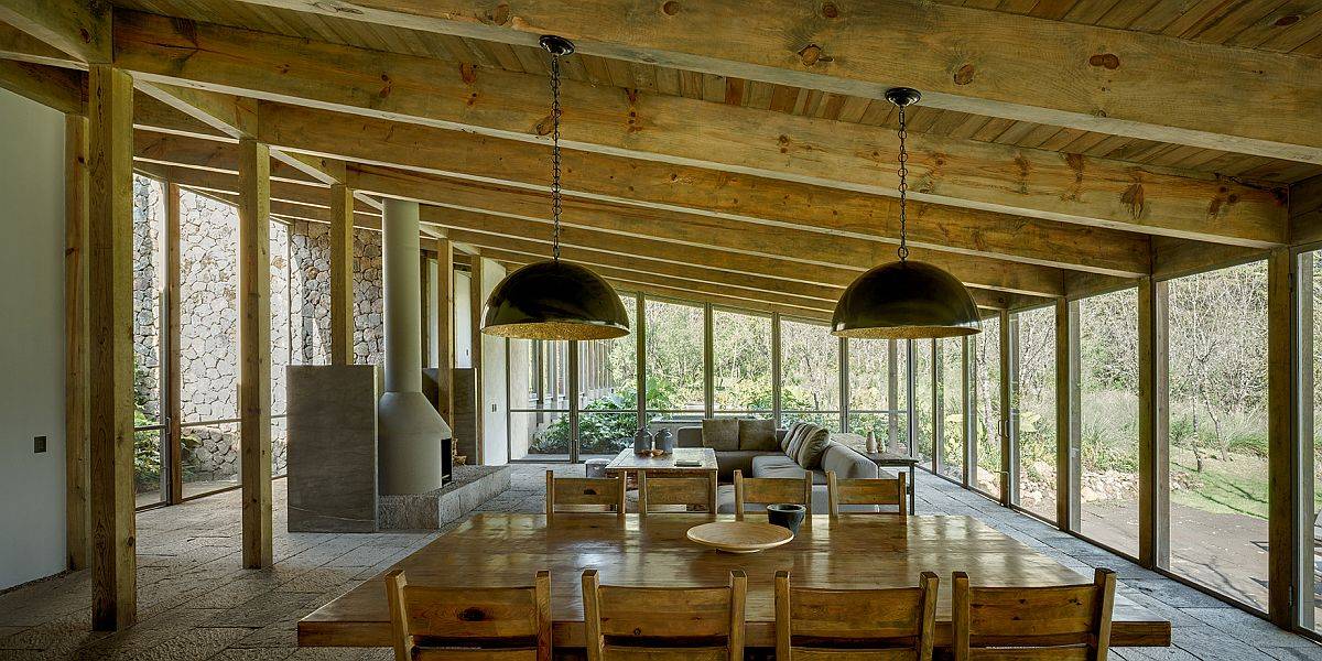 Open living area, dining room and kitchen of the home in forest in Mexico