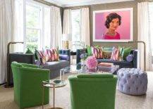 purple couches green club chairs wide shot living room with vintage woman wall art