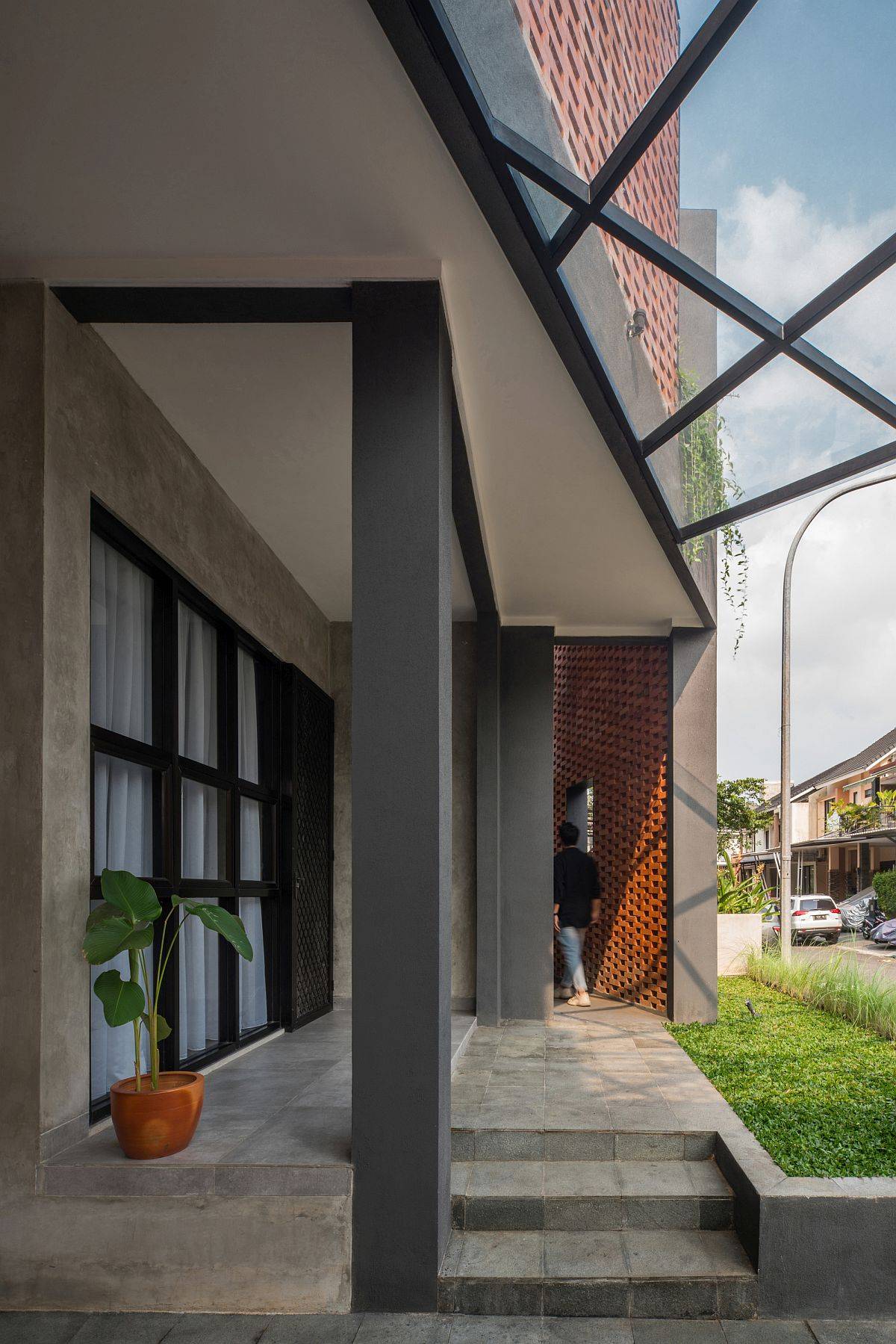 Renovated home in Indonesia with a brick facade that makes plenty of difference to its visual appeal