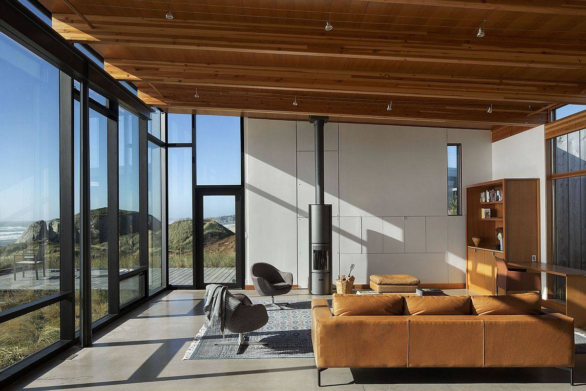 Slanted ceiling of the living room with wooden beams adds something unique to the living space