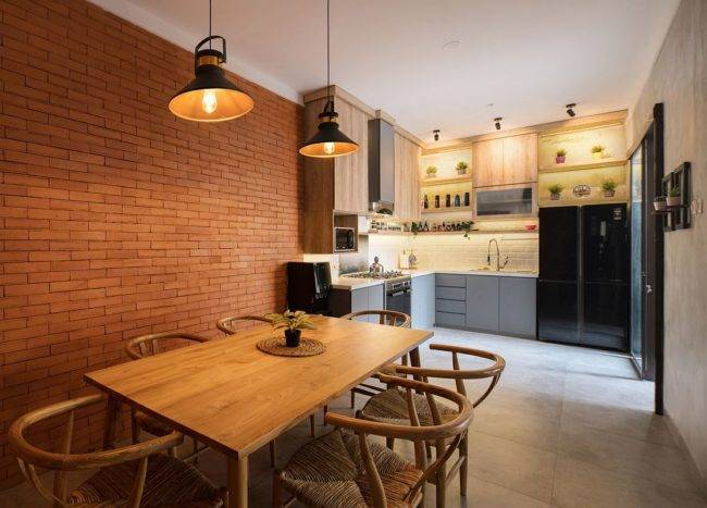 Small-kitchen-and-dining-area-of-the-lovely-Indonesian-home-withe-xposed-brick-walls-and-concrete-finishes-39640-217x155
