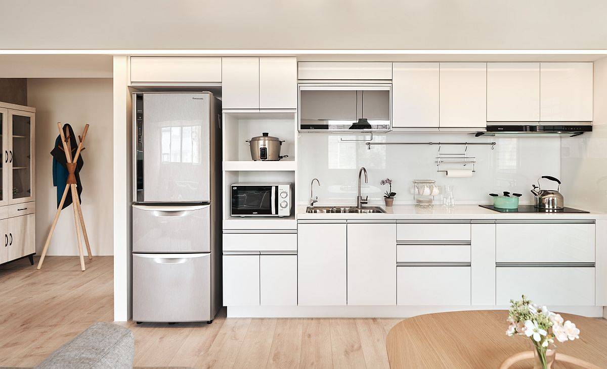 Smart-and-space-savvy-single-wall-kitchen-in-white-with-ample-storage-space-66958