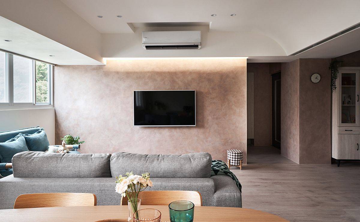 Snazzy and stylish LED lighting illuminates the accent wall in the living space beautifully