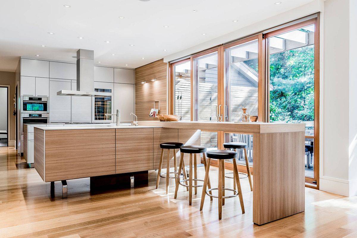 Spacious and stylish wooden breakfast bar offers ample sitting space for entire family