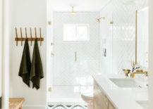 White-brass-and-wood-bathroom-with-herringbone-pattterned-shower-area-that-makes-a-difference-68743-217x155