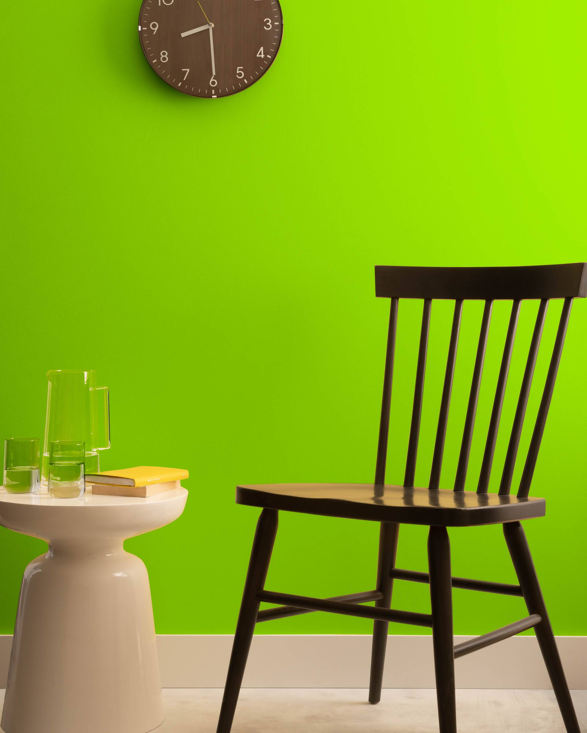 bright green wall lime green benjamin moore black chair clock on wall