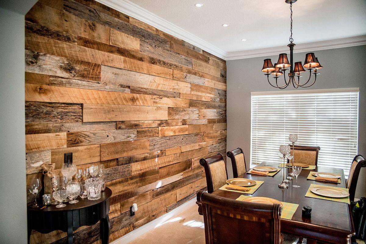 Beautiful reclaimed wood accent all steals the spotlight in this dining room