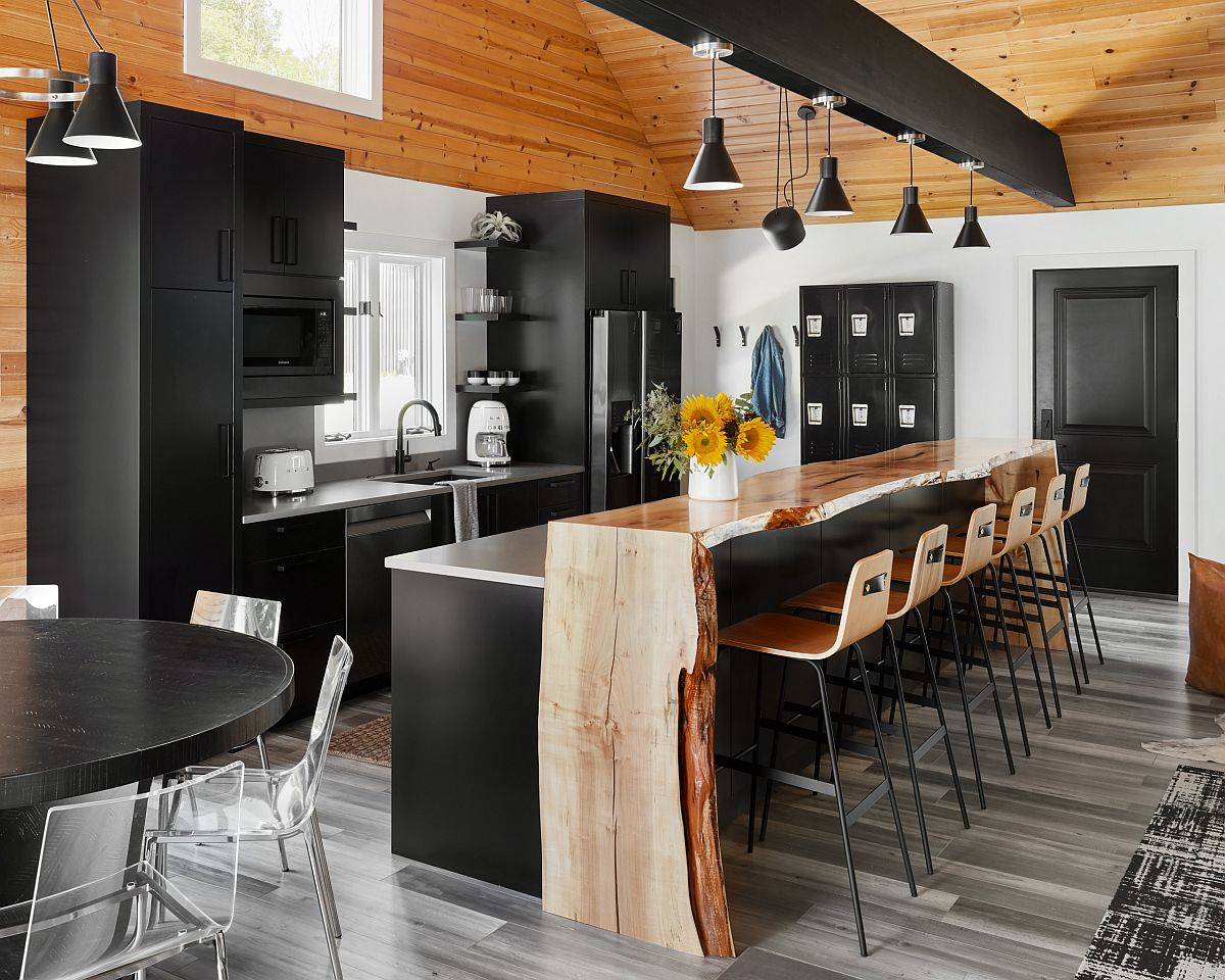 Breakfast bar in live-edge wood adds textural contrast to this wonderful modern kitchen