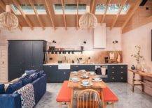 Eye-catching-Scandinavian-style-kitchen-with-light-pink-walls-brings-orange-to-the-setting-using-twin-benches-at-the-dining-table-74313-217x155