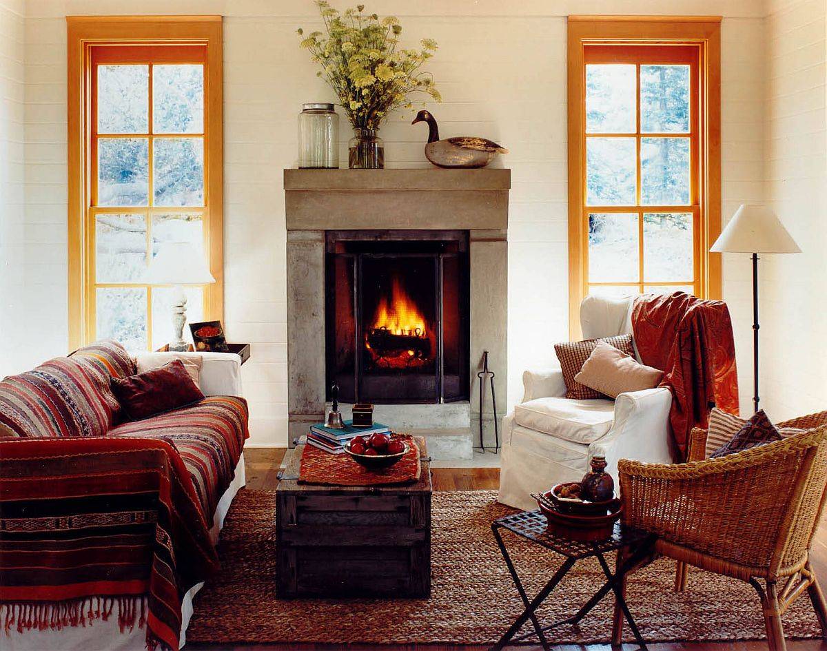 Fireplace, throws and rug shape this small yet comfy living room