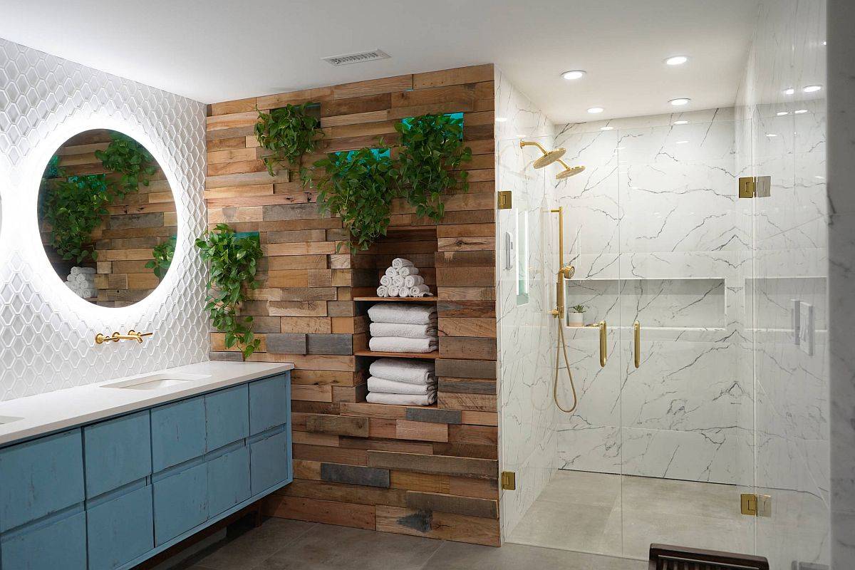 Gorgeous modern Scandinavian bathroom with accent wooden wall and lovely back-lit mirrors