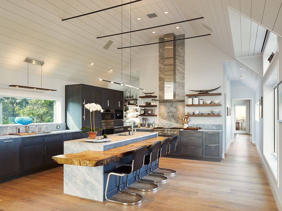 Spacious New York kitchen with marble island that is complemented by a fabulous live-edge breakfast bar