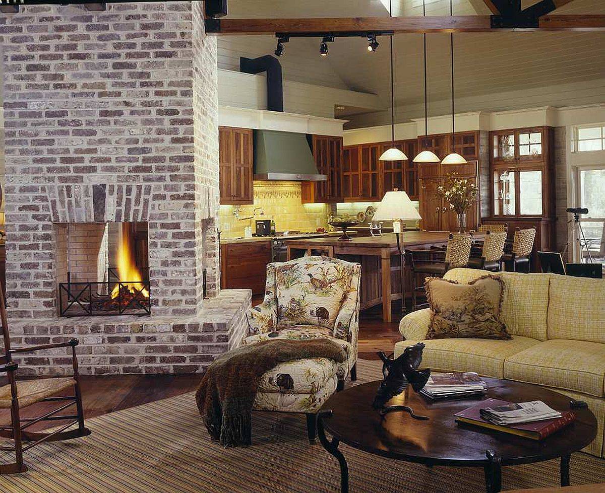 Two-sided fireplace serves both the living room and the kitchen in here