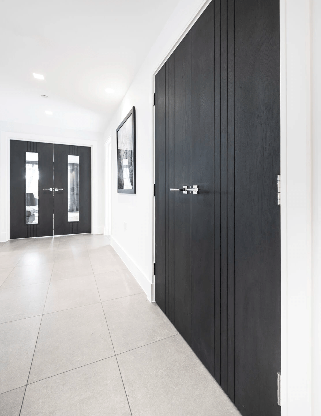 Wood Double Doors Create Warm Contrast On Elegant Home