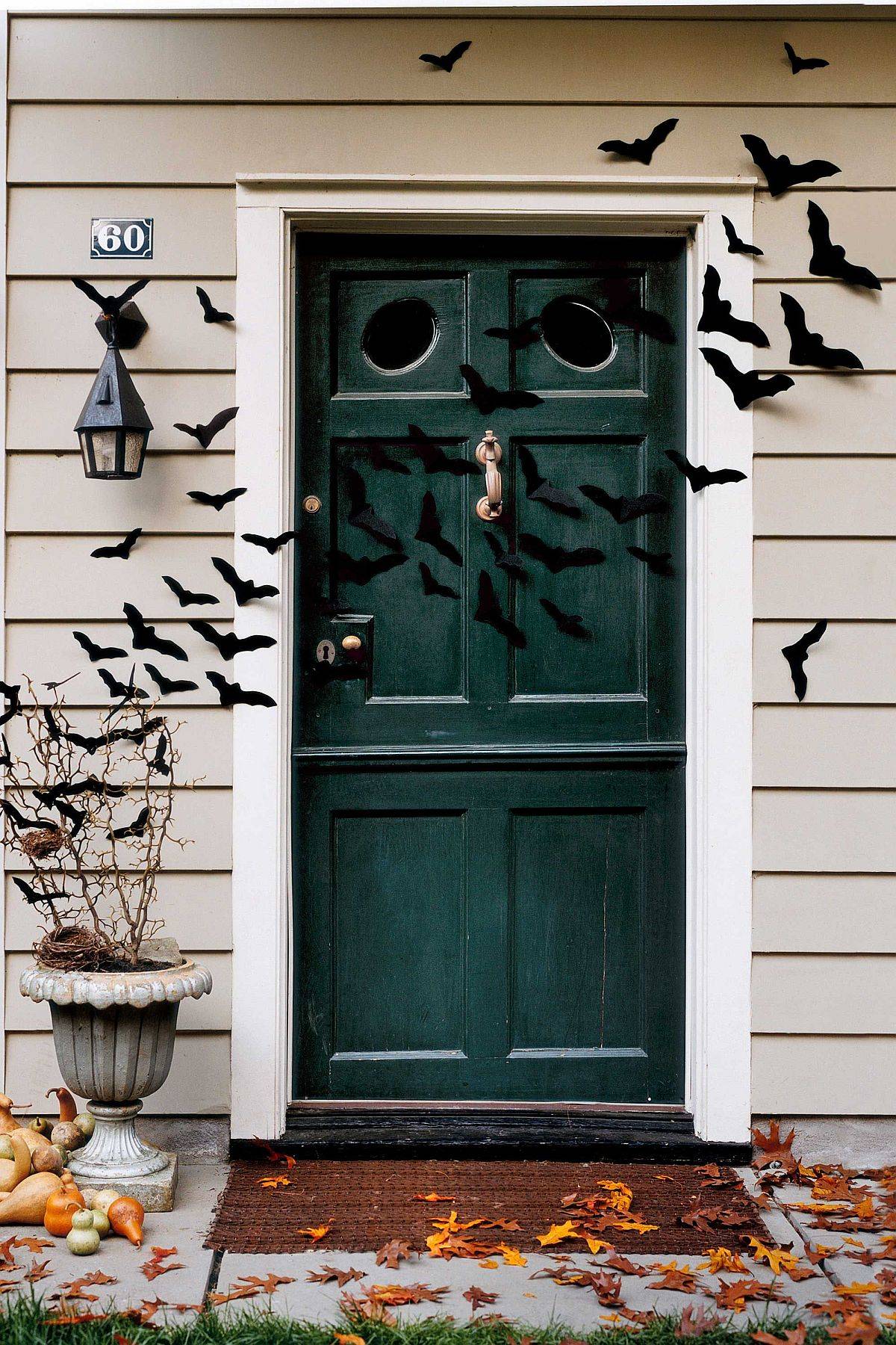Bat cut-outs and pumpkins offer an easy way to decorate the entry in style