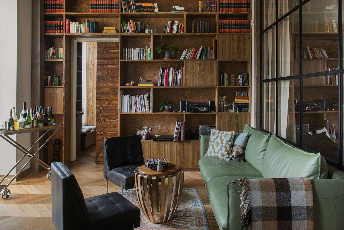 Booklover's living room with custom shelves in the backdrop that offer ample storage space